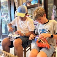 Father-and-son-bonding-while-making-a-lantern-in-Hoi-An